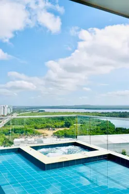 a view of a swimming pool on top of a building at Premium Hub Ocean View Apartment in Cartagena 905 in Cartagena de Indias