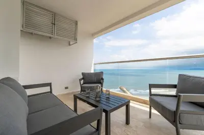 a living room with a view of the ocean at CB1629 | Suite moderna con vista 180 mar ciudad in Cartagena de Indias