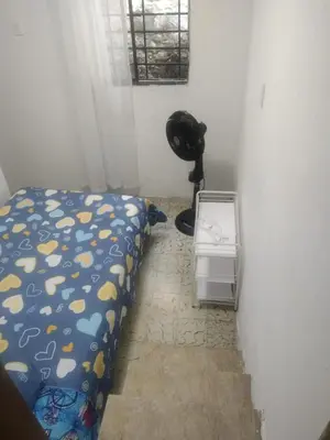 a bedroom with a bed and a fan in a room at Habitacion privada con servicios incluidos in Barranquilla