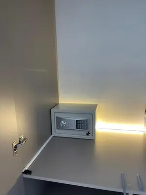 a small room with a tv on the wall at Modern apartment near the airport in Cartagena de Indias