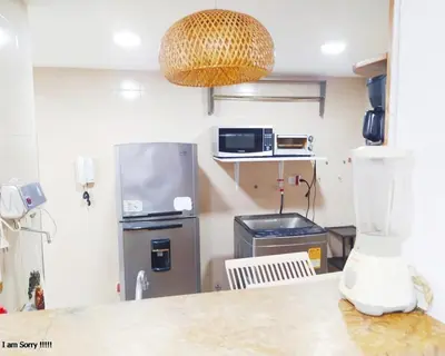 a kitchen with a refrigerator and a counter top at apartamento con vista al mar y centro histórico in Cartagena de Indias