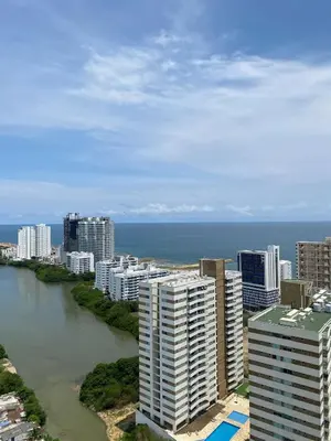 an aerial view of a city with a river and buildings at U-GO Sunset Frente al Mar in Cartagena de Indias