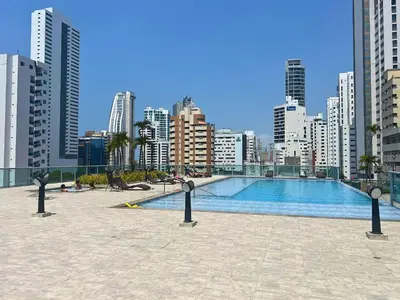 a swimming pool in a city with tall buildings at Chic Apartment Near It All in Cartagena de Indias