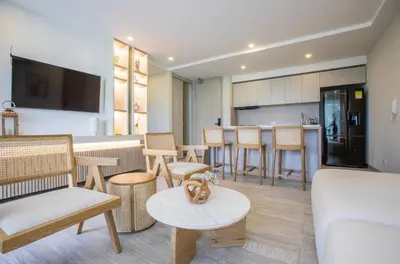 a living room with a dog sitting on a table at Impresionante vista Dominique 2 suites in Cartagena de Indias