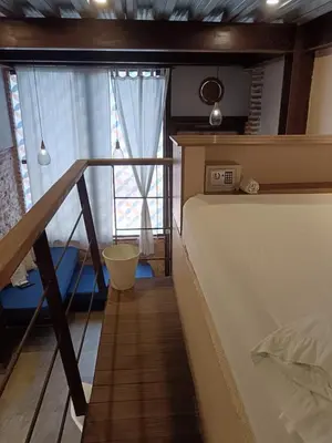 a bedroom with a bed and a large window at Hermoso apartamento con patio privado in Cartagena de Indias