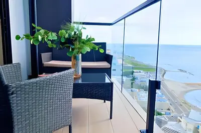 a dining room with a table and chairs and the ocean at Oceanfront Gem by Walled City, Spectacular Views in Cartagena de Indias