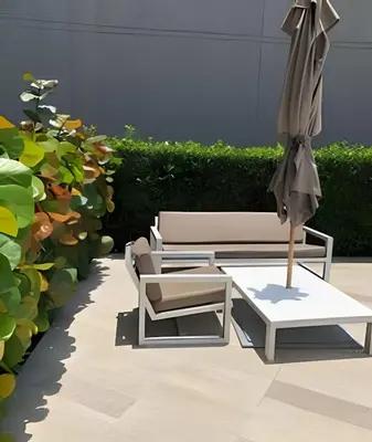 a patio with two chairs and an umbrella at Breathtaking ocean view, central location in Cartagena de Indias