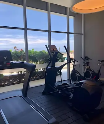 a gym with cardio machines in front of a window at Breathtaking ocean view, central location in Cartagena de Indias
