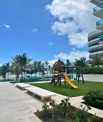 a playground with a slide in a park at Lindo apto con salida directa a la playa in Cartagena de Indias