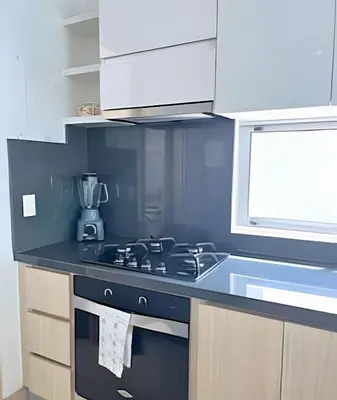 a kitchen with a black stove and a sink at Coastal Charm with Mesmerizing Seaside Views in Cartagena de Indias