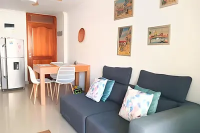 a living room with a couch and a table at Precioso Apto a pasos de la playa, ubicación ideal in Cartagena de Indias