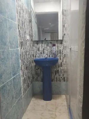 a bathroom with a blue sink and a shower at Back house gallery in Cartagena de Indias
