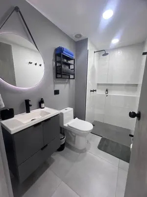 a bathroom with a sink and a toilet and a shower at Apartasuite en Cartagena in Cartagena de Indias