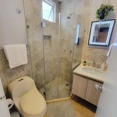a bathroom with a shower and a toilet and a sink at View, exit to Playa Morros tres Cartagena in Cartagena de Indias