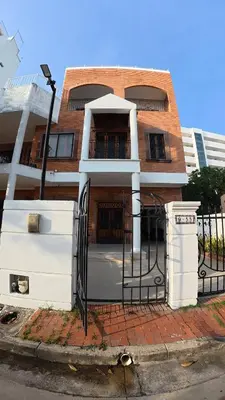 a building with a gate in front of a building at Casa cerca al mar Zona Norte Cielo Mar Cartagena in Cartagena de Indias