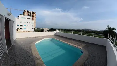 a swimming pool on the balcony of a house at Casa cerca al mar Zona Norte Cielo Mar Cartagena in Cartagena de Indias