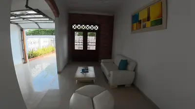 a living room with a couch and a table at Casa cerca al mar Zona Norte Cielo Mar Cartagena in Cartagena de Indias
