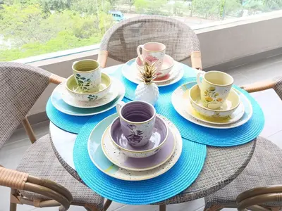 a table with four cups and saucers on it at Un Espacio para soñar in Santa Marta