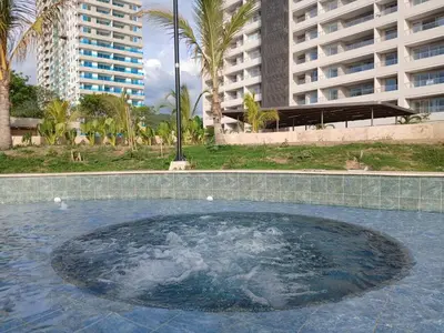 a large pool of water in front of some buildings at Un Espacio para soñar in Santa Marta
