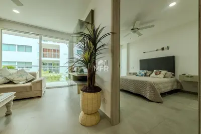 a bedroom with a bed and a potted plant at Morros 3, 1 Bedroom & Seaview in Cartagena de Indias