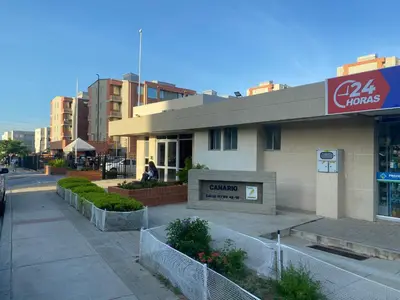 a building on a street in a city at Apartamento Alameda del Rio in Barranquilla