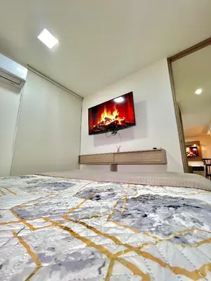 a bedroom with a flat screen tv on the wall at Luxury Apartament With Pool in Barranquilla