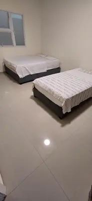 two beds are sitting in a room at Casa 4 Barrio El Prado in Barranquilla
