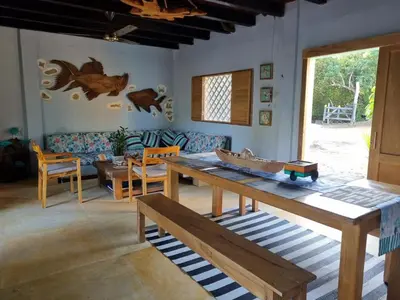 a living room with a table and a couch at Veleta Playa Calao in San Antero