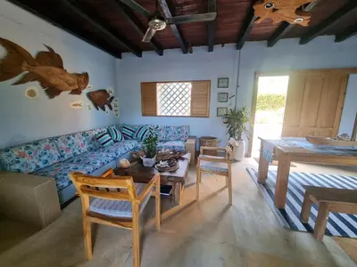 a living room with a couch and a table at Veleta Playa Calao in San Antero