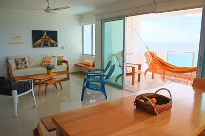 a living room with a couch and chairs at Magico Apartamento Frente al Mar 3 Habitaciones B41 in Coveñas