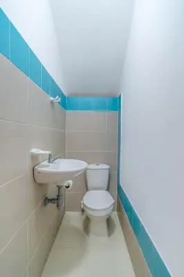 a bathroom with a toilet and a sink at Casa Vianca Beach in Estación El Salto