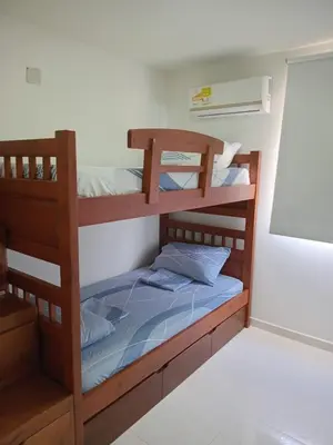 a bedroom with two bunk beds in a room at Conjunto Residencial Caribe Campestre in Coveñas