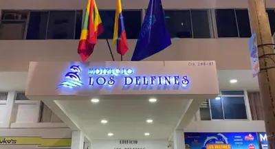 a sign in a building with different colored flags at Apartamento playa Bocagrande Los Delfines Cartagena in Cartagena de Indias