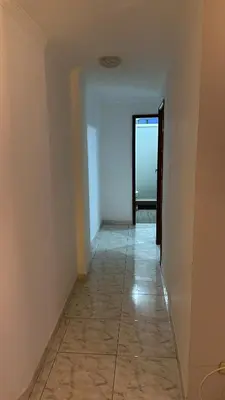 an empty hallway with a tile floor and a door at Apartamento 84 - 2 habitaciones in Barranquilla