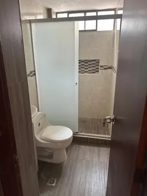 a bathroom with a toilet and a shower at Apartamento 84 - 2 habitaciones in Barranquilla