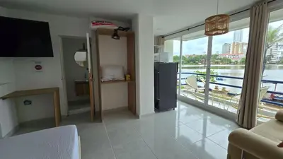 a living room with a view of the water at Loft MR1-4G facing the sea in a high level neighborhood in Cartagena de Indias