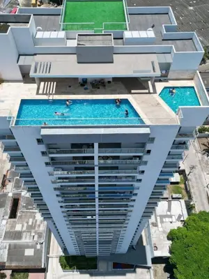 an overhead view of a building with two swimming pools at Excepcional apartamento en zona de negocios in Cartagena de Indias