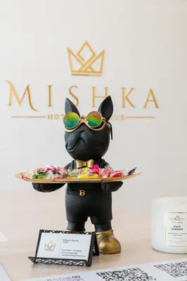 a statue of a mickey mouse holding a plate of food at Mishka Hotel Boutique Habitación 103 in Cartagena de Indias