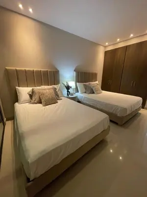 two beds in a hotel room with two beds at Mistral Exclusive oceanfront apartment with balcony in Cartagena de Indias