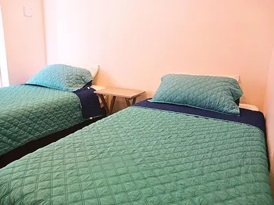 two beds sitting next to each other in a room at Apartamento en condominio de lujo morros eco. in Cartagena de Indias