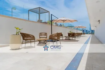 a patio with chairs and tables on a building at Suite romántica con terraza lounge y vista panorámica CB834 in Cartagena de Indias