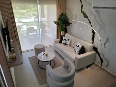 a living room with a couch and a table at Baia Kristal - Vacaciones Cartagena Colombia in Cartagena de Indias