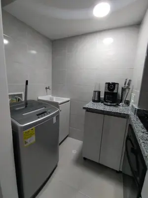a small kitchen with a sink and a dishwasher at Sol y Brisa 811 in Cartagena de Indias