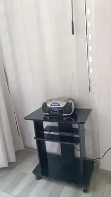a black desk with a phone on top of it at Isabela House in Barranquilla