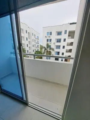 a balcony with a view of a large building at Vacaciones Inolvidables in Coveñas