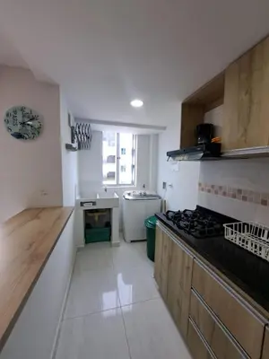 a kitchen with a stove and a counter top at Vacaciones Inolvidables in Coveñas