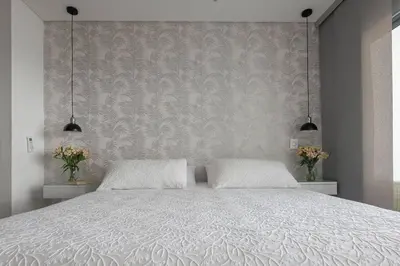 a bedroom with a white bed with two pillows at Apartment With Beautiful View In Infinitum in Cartagena de Indias