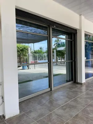 an open sliding glass door of a building at Habitaciones Melany in Coveñas