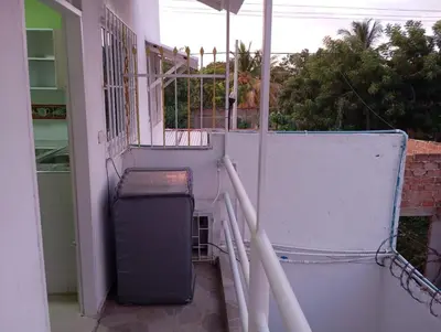 an empty balcony with a trash can at Apartamentos el farol in Ciénaga