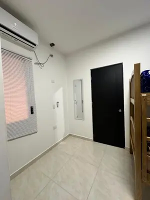 a room with a black door and a white wall at Apto 2 hab Cerca del Centro Histórico in Cartagena de Indias